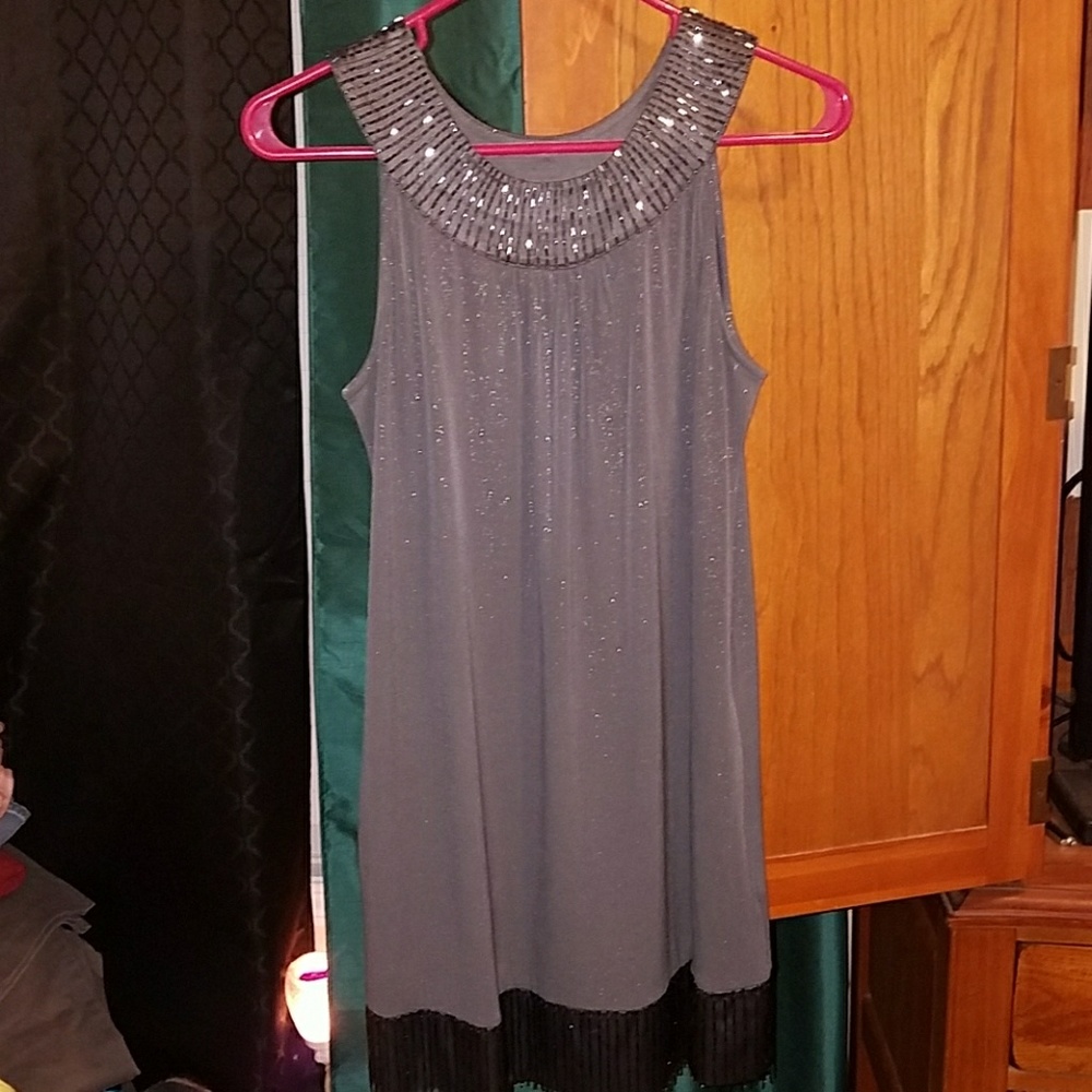Shimmery gray dress with detail around the neck